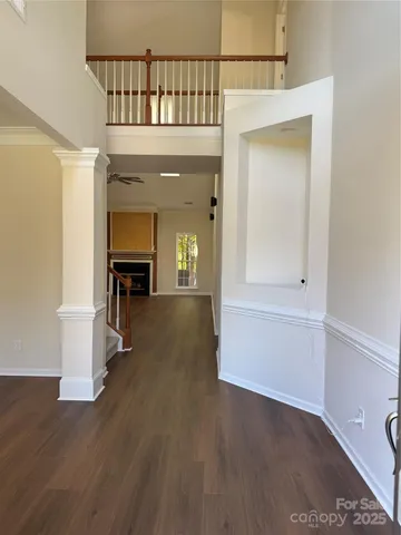a view of an entryway with wooden floor