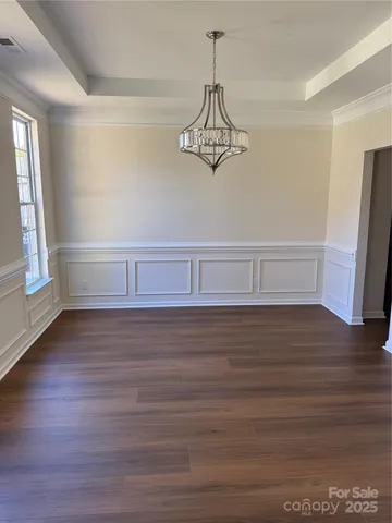 a view of room with hardwood floor
