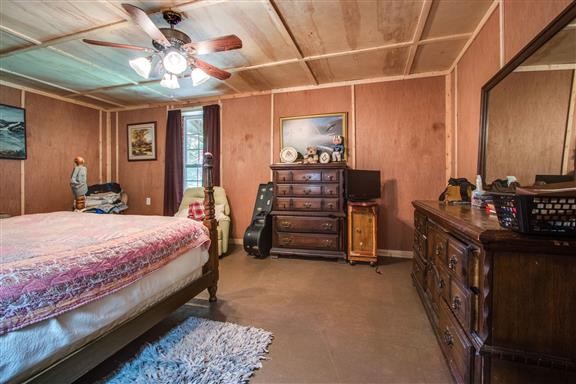 135 Shop Road Dunlap, TN 37327 - Photo 20 of 23 a bedroom with a bed and a chandelier
