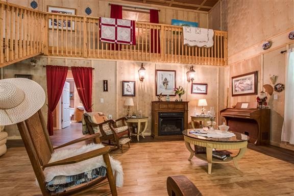 135 Shop Road Dunlap, TN 37327 - Photo 7 of 23 a living room with furniture a fireplace and a table