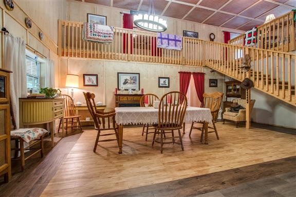 135 Shop Road Dunlap, TN 37327 - Photo 9 of 23 a view of a dining room with furniture a chandelier and wooden floor
