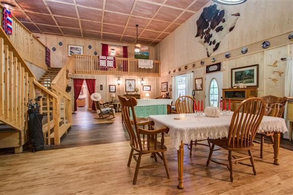 135 Shop Road Dunlap, TN 37327 - Photo 10 of 23 a view of a dining room with furniture a chandelier and wooden floor