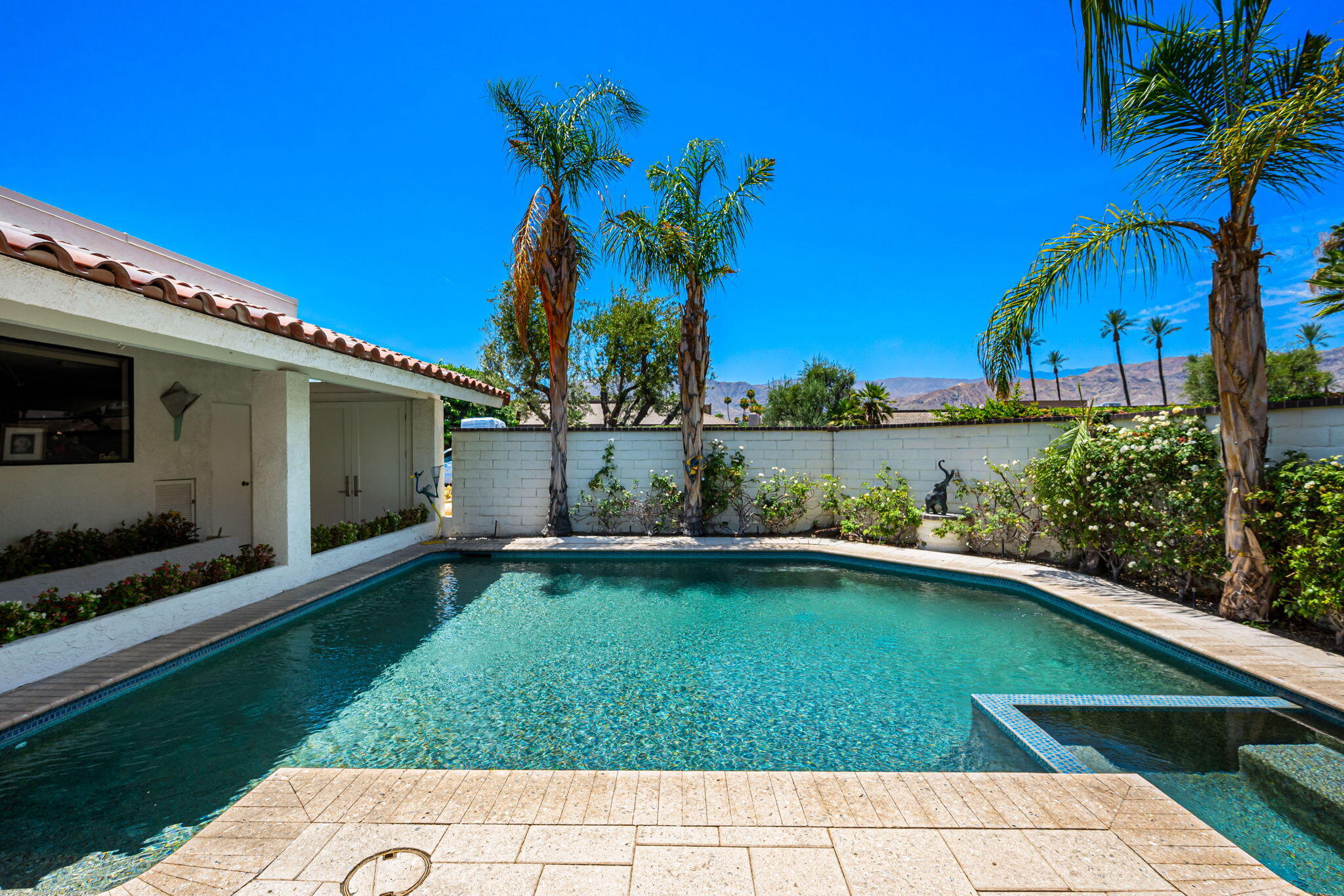 4 Reed Court Rancho Mirage, CA 92270 - Photo 1 of 42 a view of a backyard with a garden