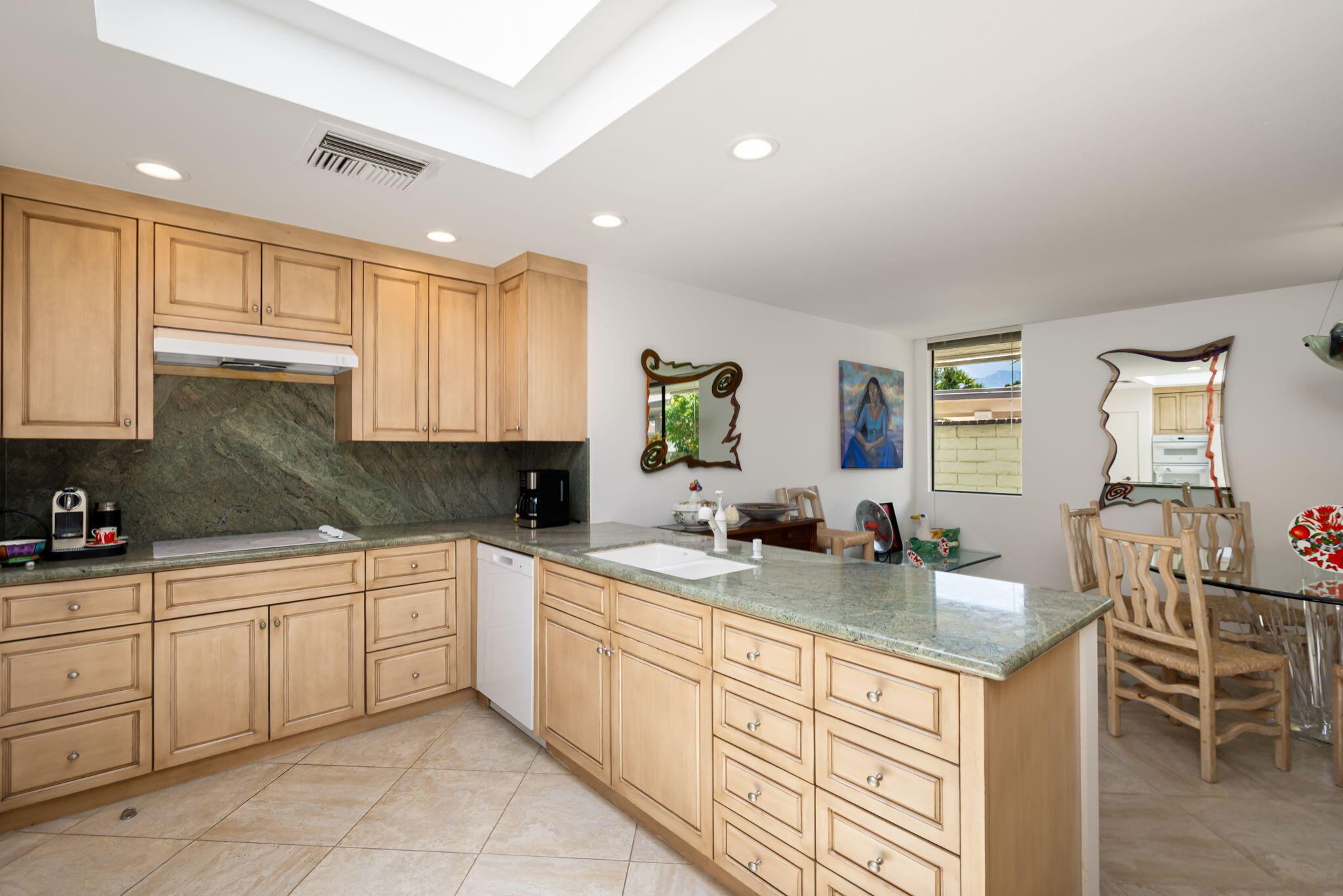 4 Reed Court Rancho Mirage, CA 92270 - Photo 12 of 42 a kitchen with a sink and cabinets