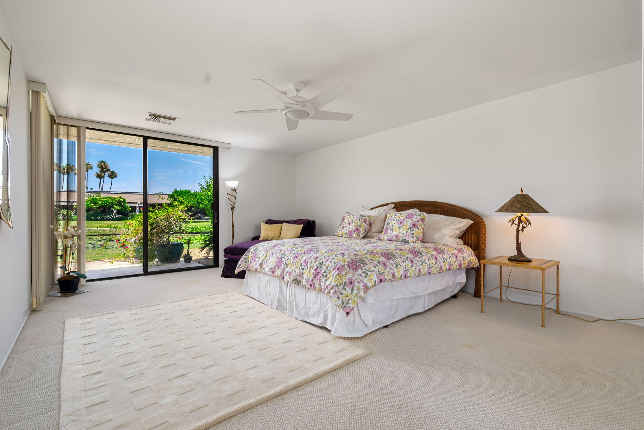 4 Reed Court Rancho Mirage, CA 92270 - Photo 14 of 42 a bedroom with a large bed and a large window