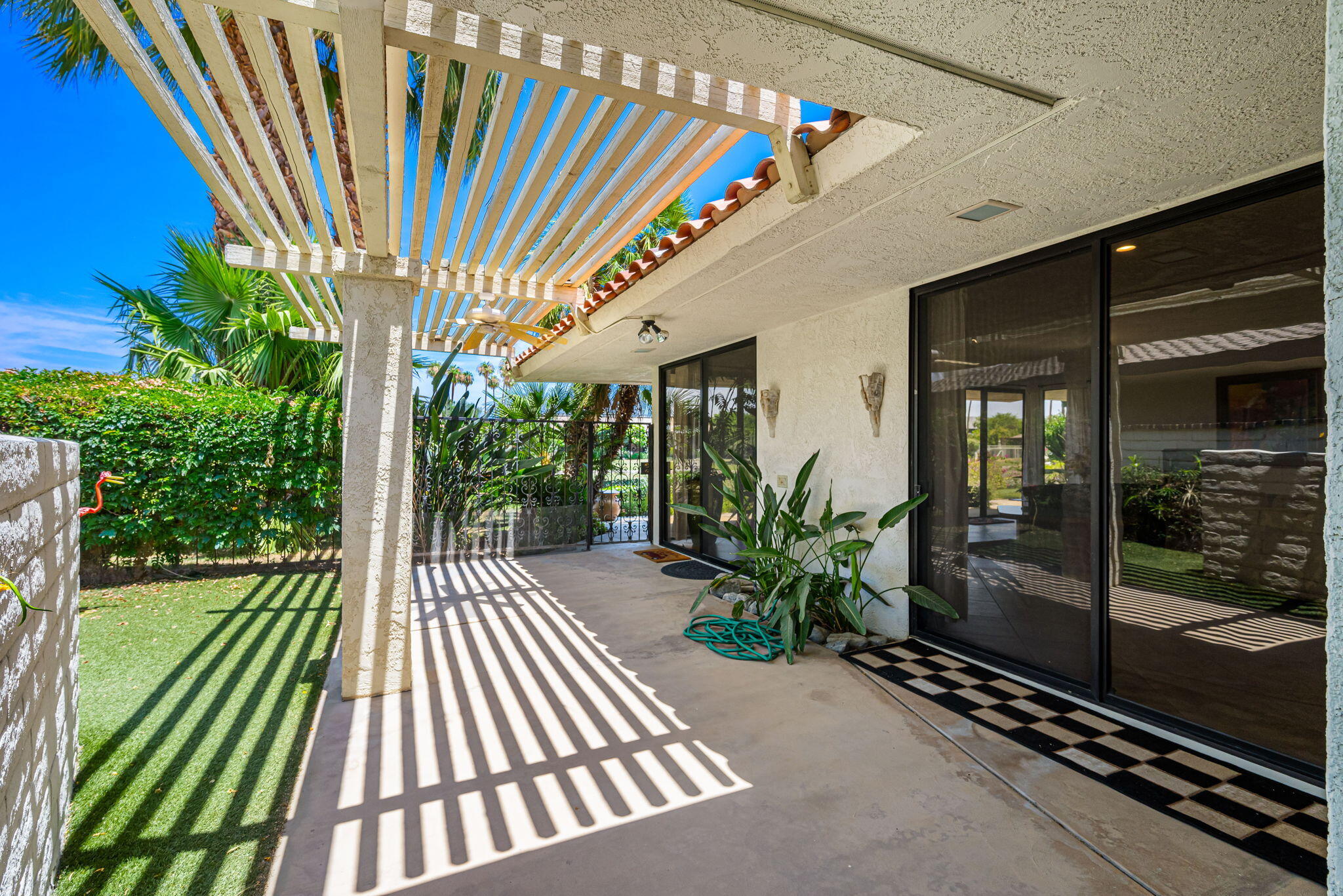 4 Reed Court Rancho Mirage, CA 92270 - Photo 15 of 42 a porch with yard in front of it