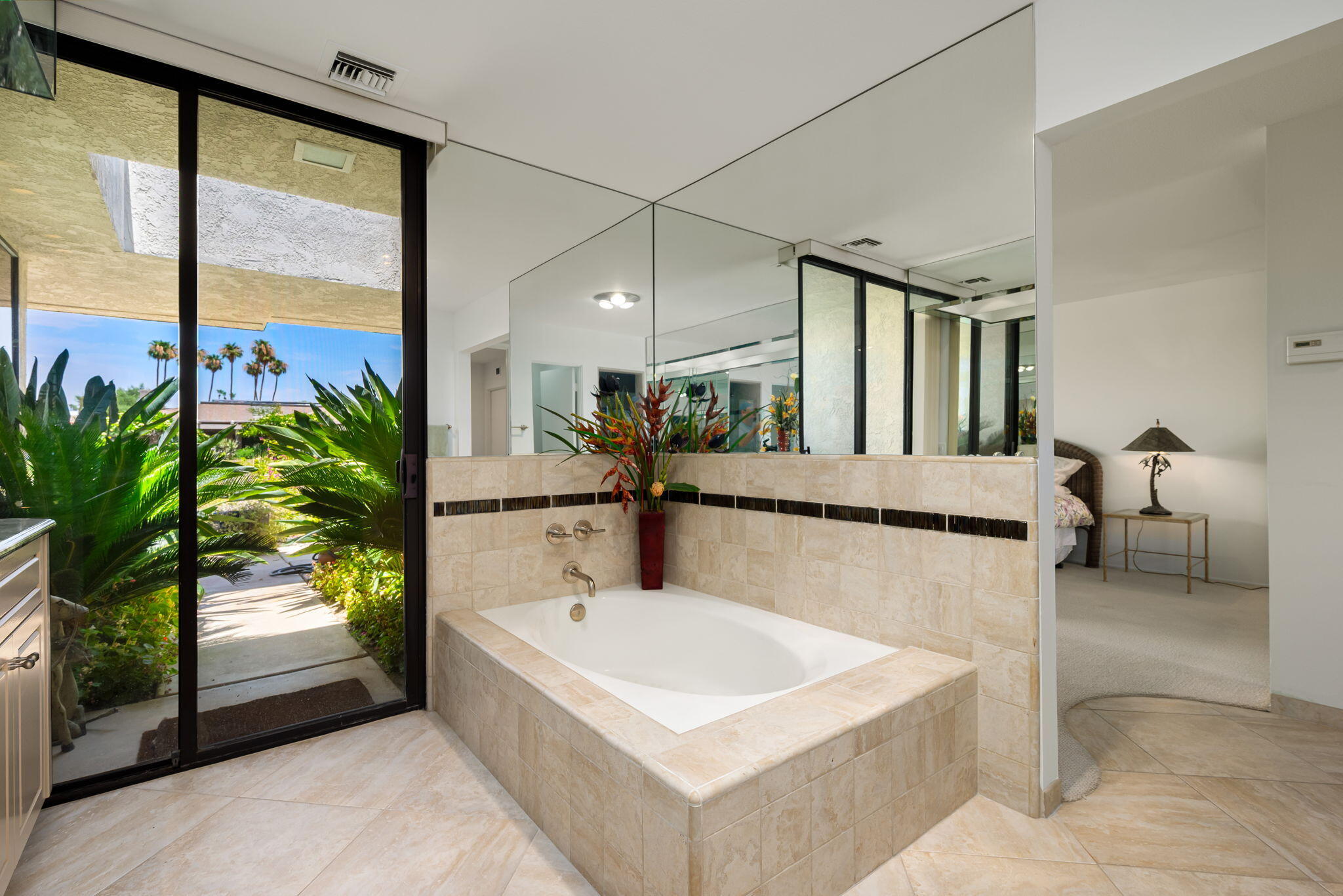 4 Reed Court Rancho Mirage, CA 92270 - Photo 18 of 42 a bathroom with a tub and a potted plant