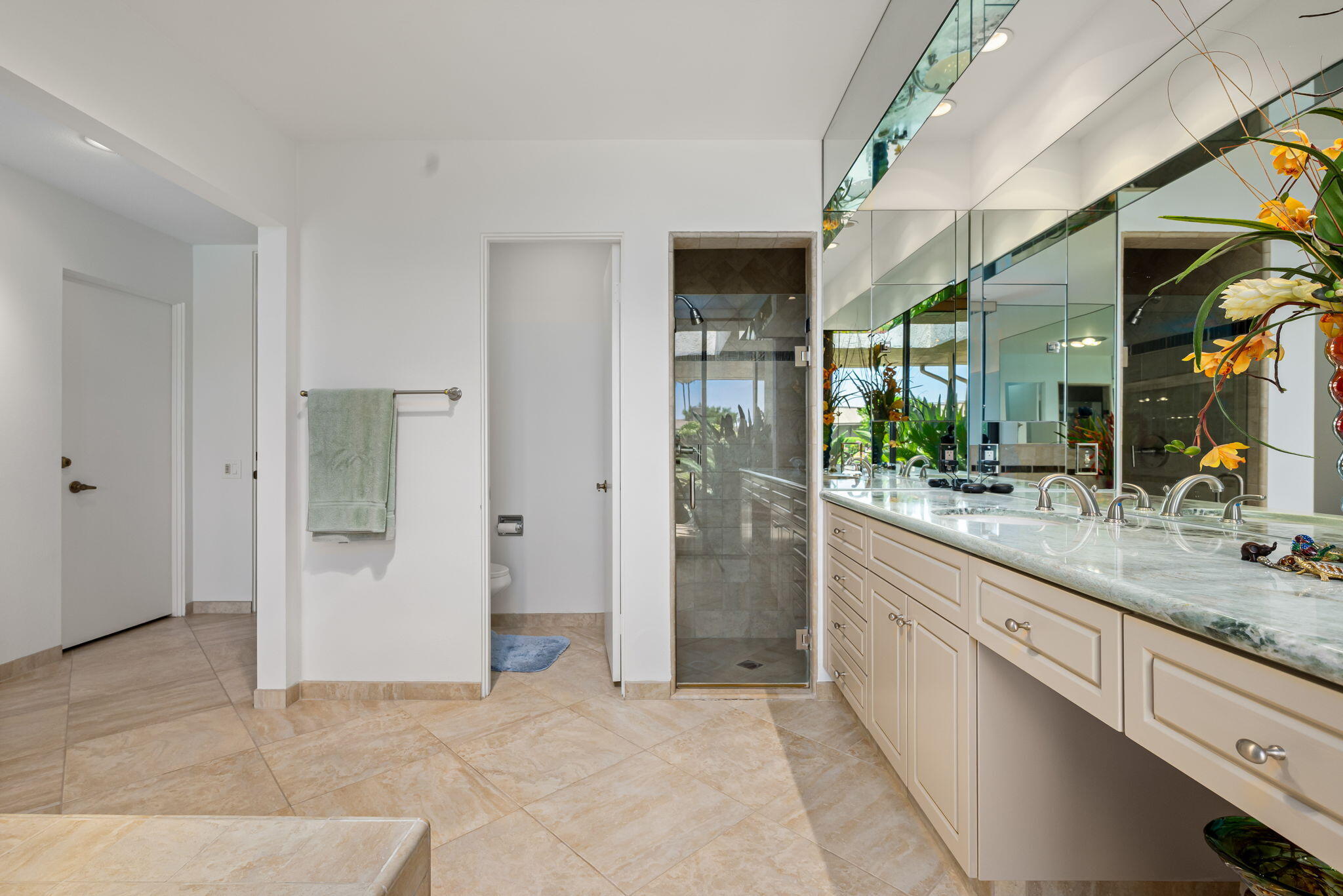 4 Reed Court Rancho Mirage, CA 92270 - Photo 19 of 42 a large bathroom with a glass door shower and sink