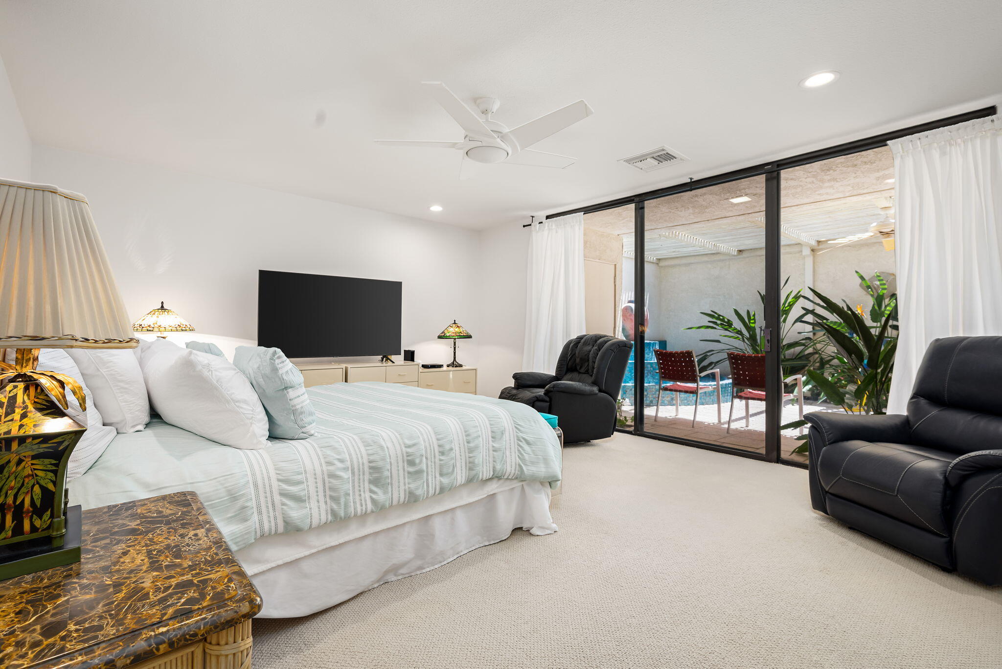4 Reed Court Rancho Mirage, CA 92270 - Photo 20 of 42 a bedroom with a large bed and a large window