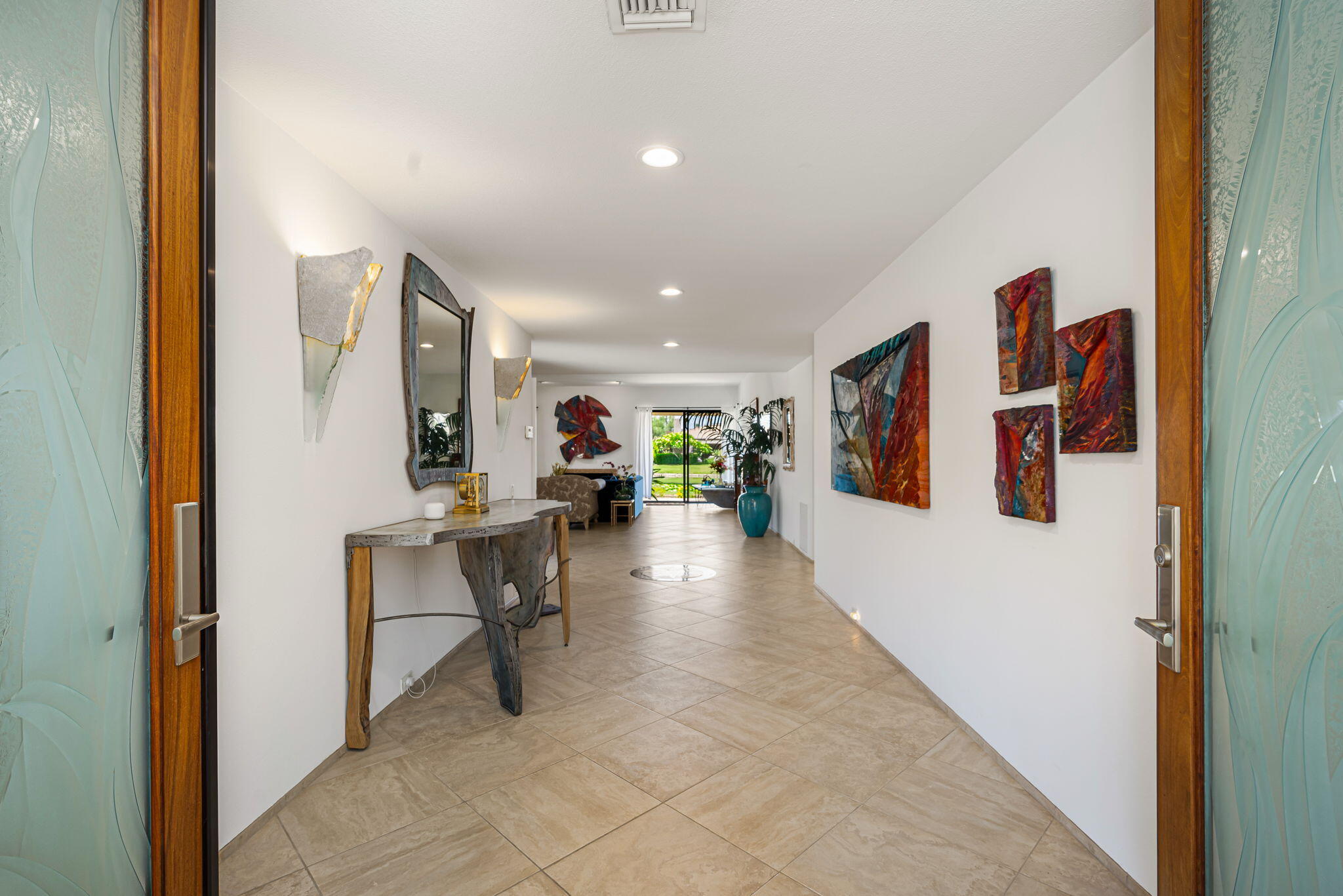 4 Reed Court Rancho Mirage, CA 92270 - Photo 2 of 42 a view of a hallway with seating area