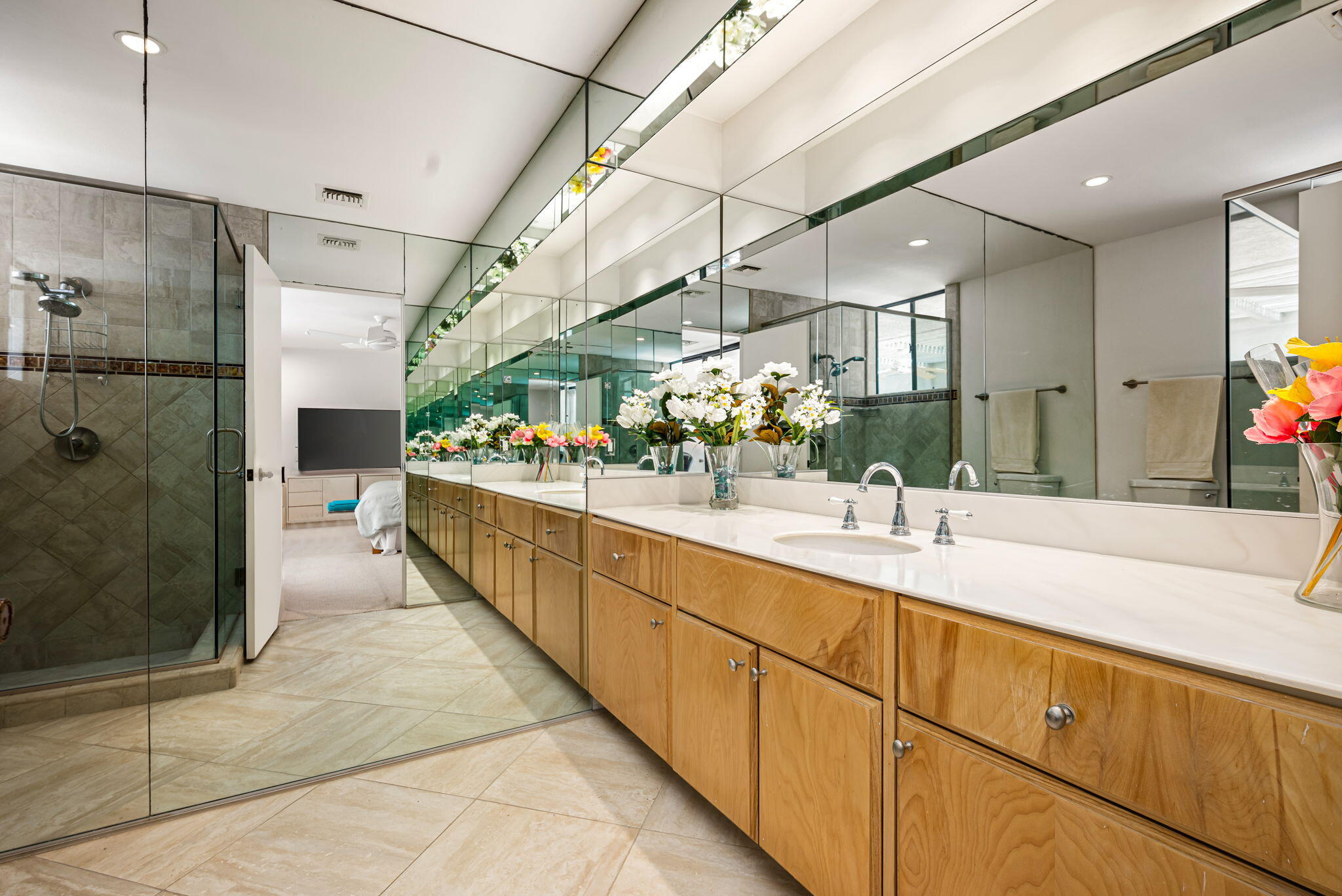 4 Reed Court Rancho Mirage, CA 92270 - Photo 22 of 42 a bathroom with a double vanity sink and mirror