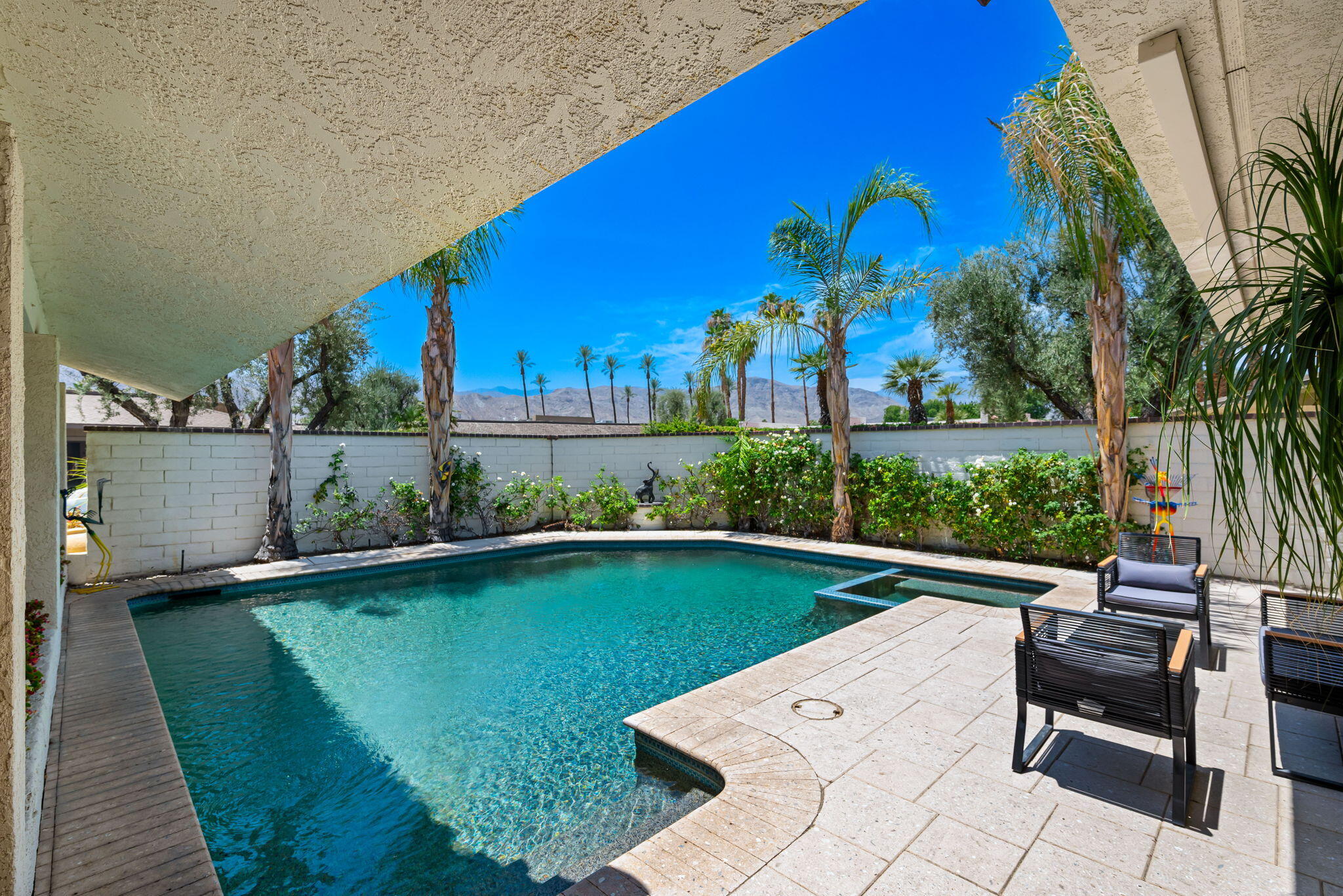 4 Reed Court Rancho Mirage, CA 92270 - Photo 24 of 42 a view of a swimming pool with a patio