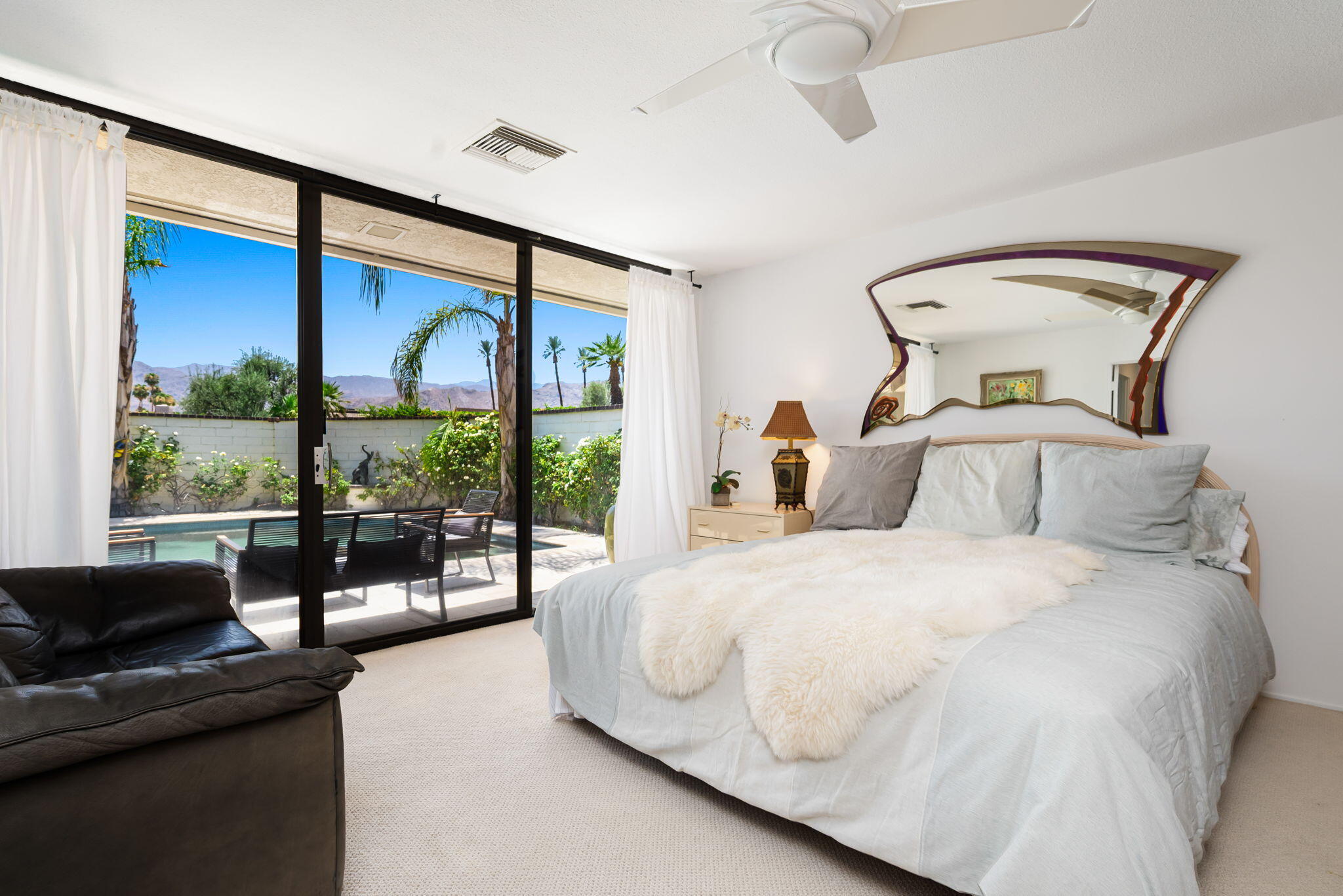 4 Reed Court Rancho Mirage, CA 92270 - Photo 25 of 42 a bedroom with a bed and large window