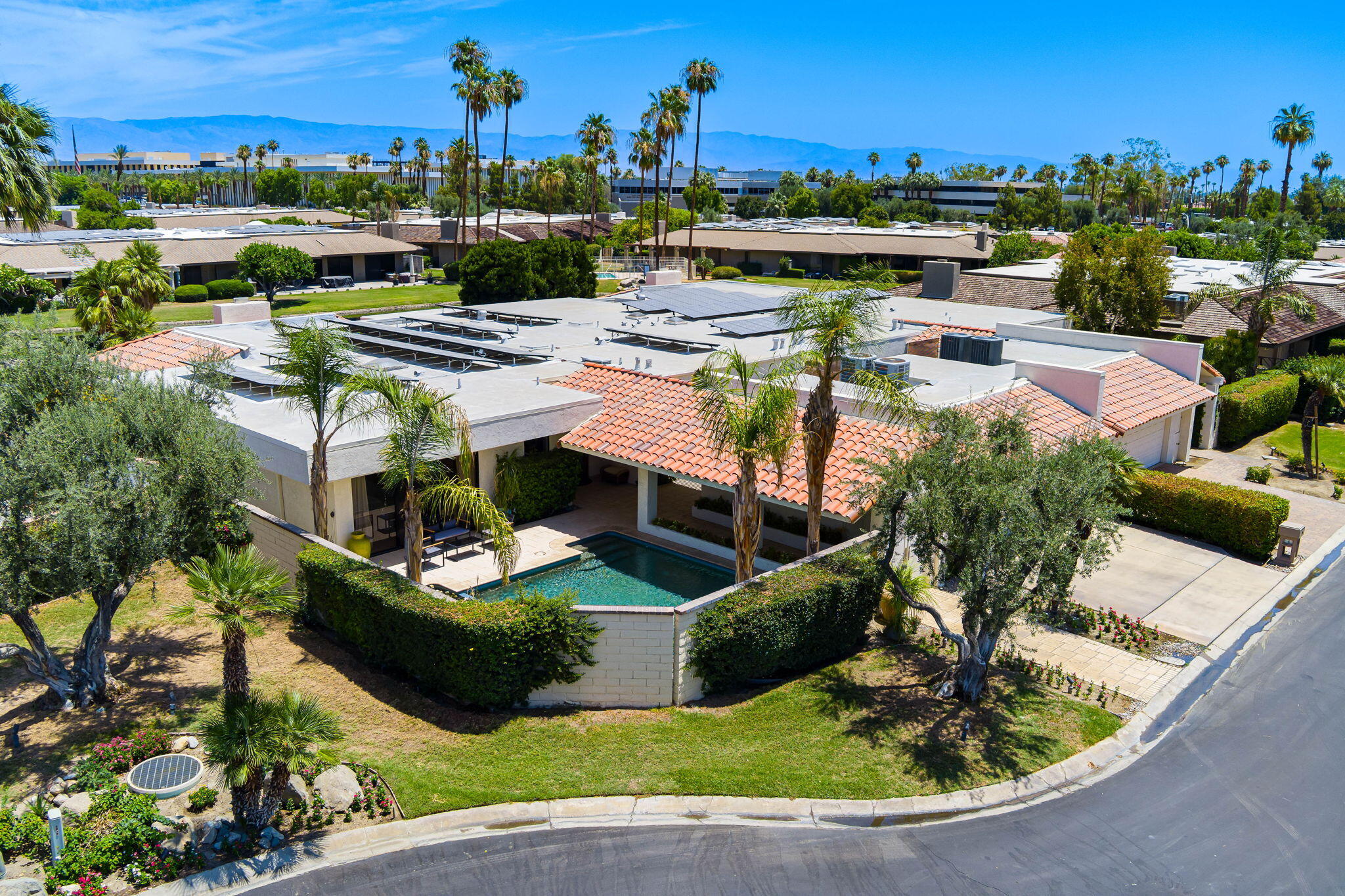 4 Reed Court Rancho Mirage, CA 92270 - Photo 28 of 42 a view of a swimming pool with an outdoor seating
