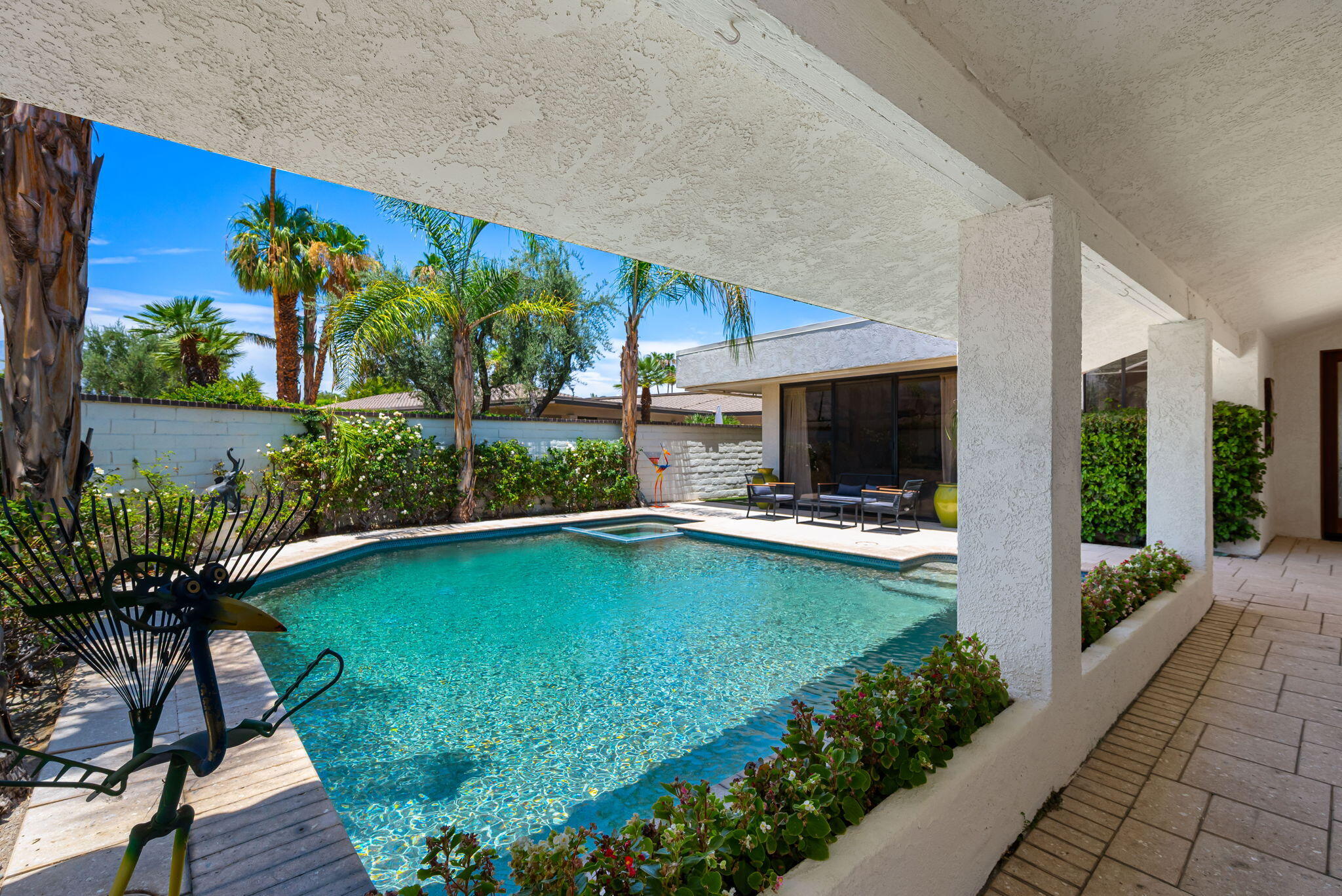4 Reed Court Rancho Mirage, CA 92270 - Photo 30 of 42 a view of a swimming pool with a patio