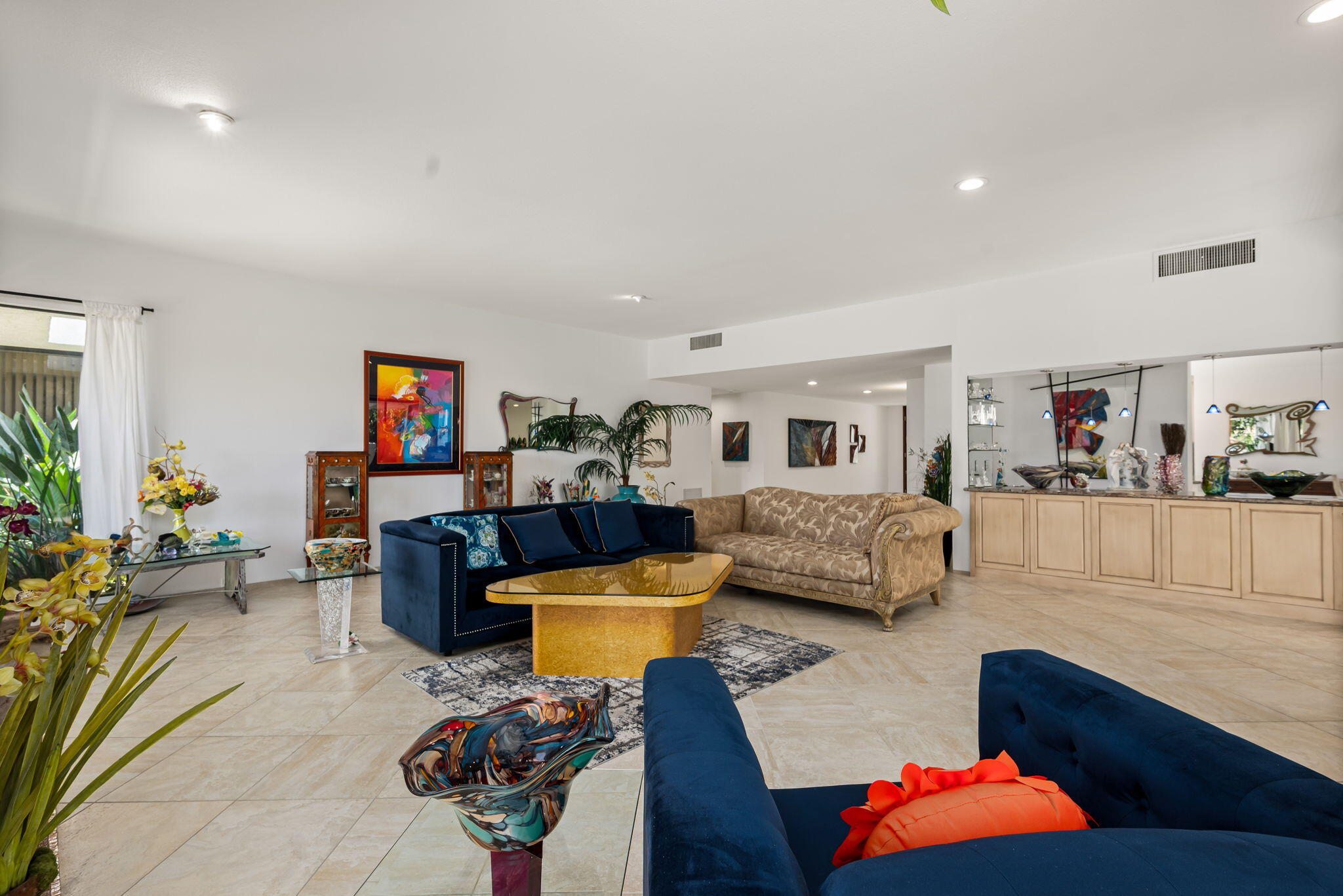 4 Reed Court Rancho Mirage, CA 92270 - Photo 3 of 42 a living room with furniture and a flat screen tv