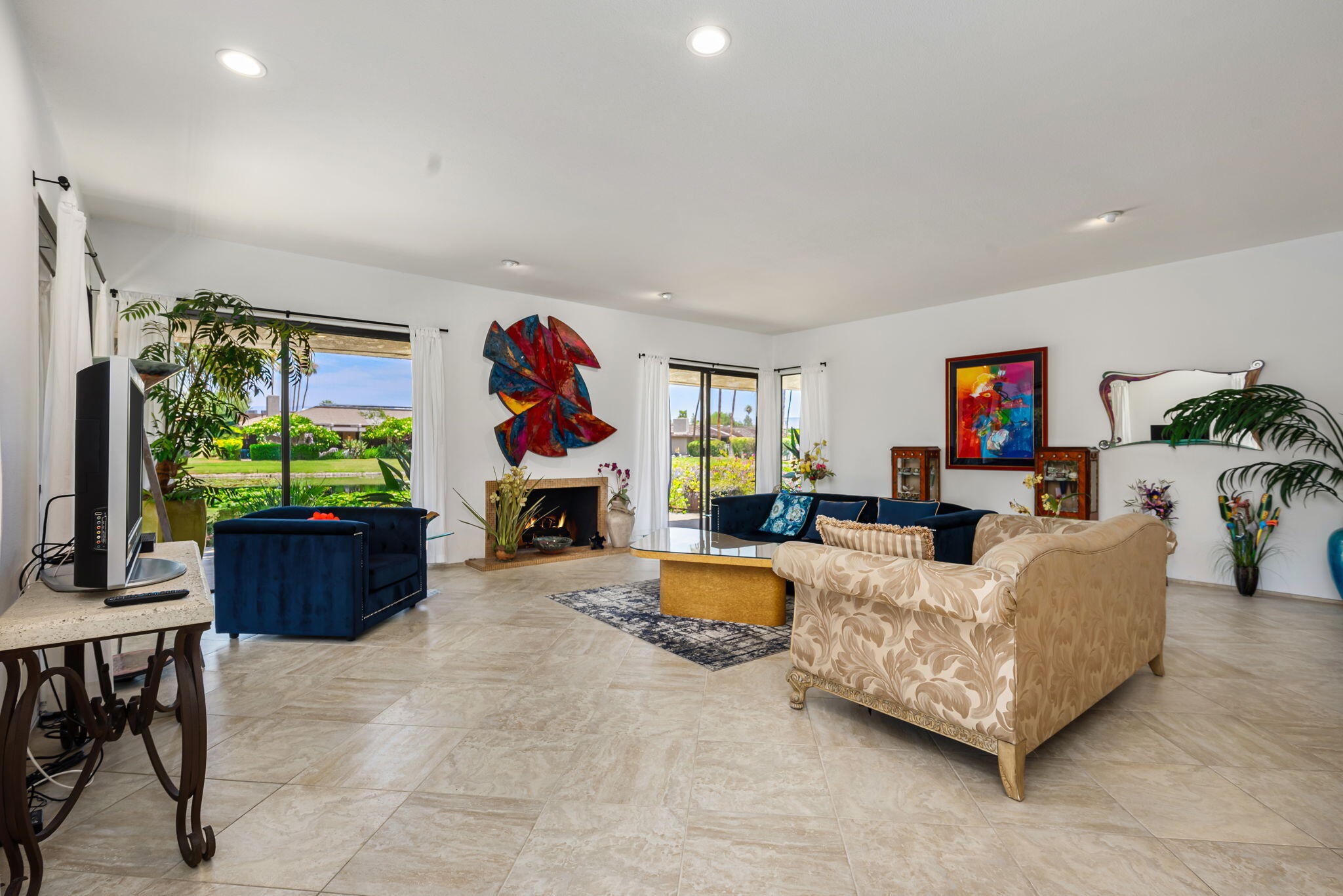 4 Reed Court Rancho Mirage, CA 92270 - Photo 6 of 42 a living room with furniture and a flat screen tv