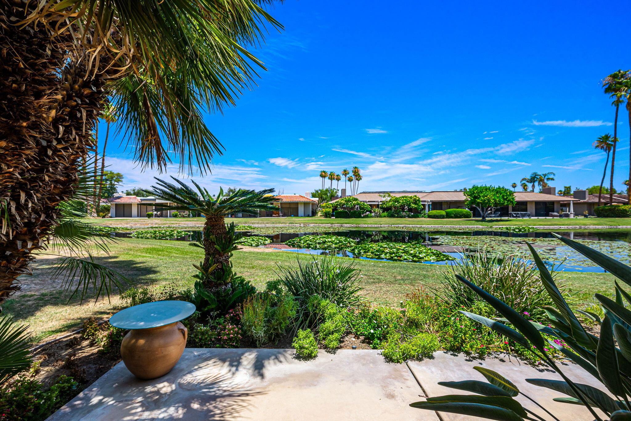 4 Reed Court Rancho Mirage, CA 92270 - Photo 8 of 42 a view of a garden with a lake view