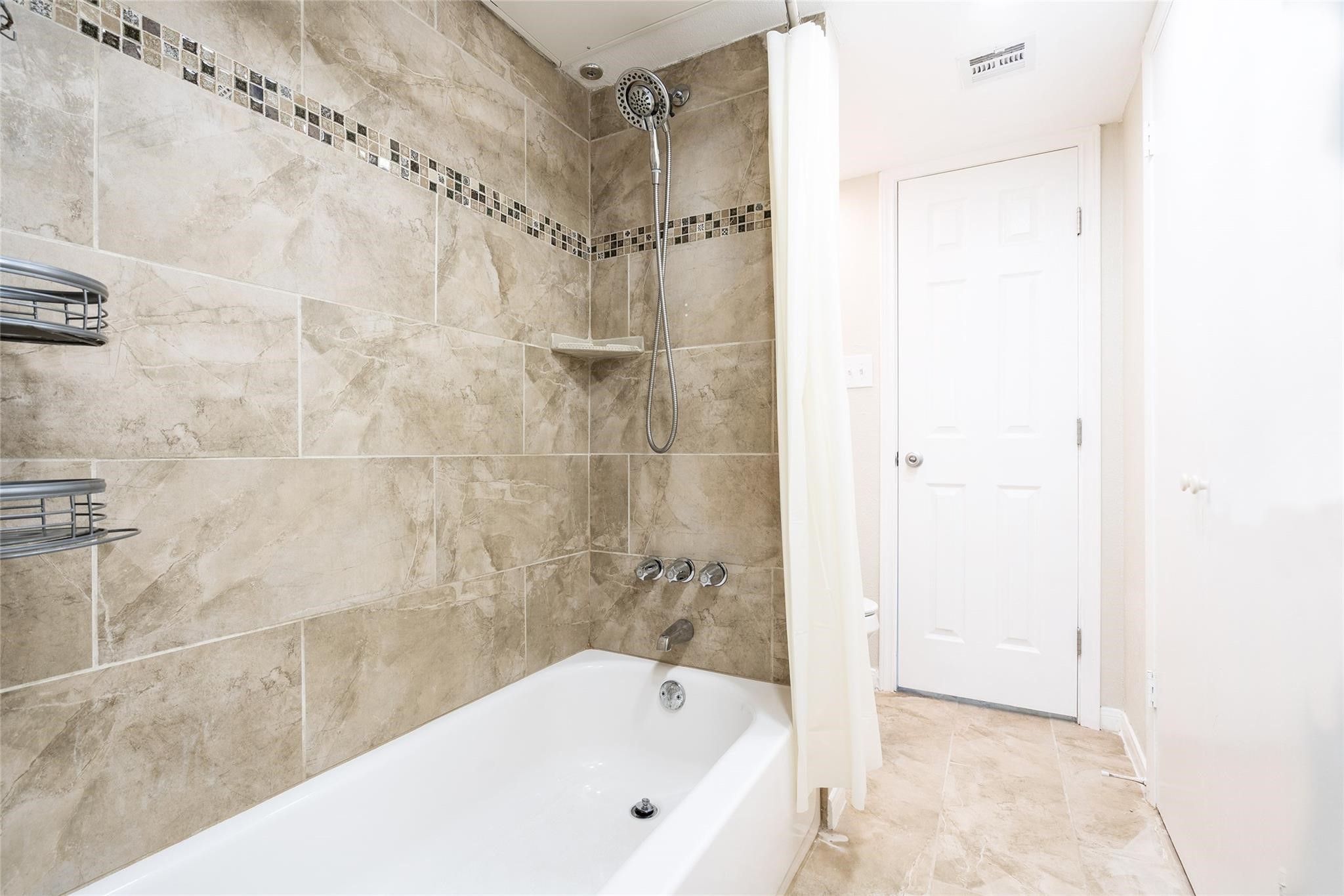 16120 Stuebner Airline Road, Unit 501 Spring, TX 77379 - Photo 18 of 23 a bathroom with a bathtub