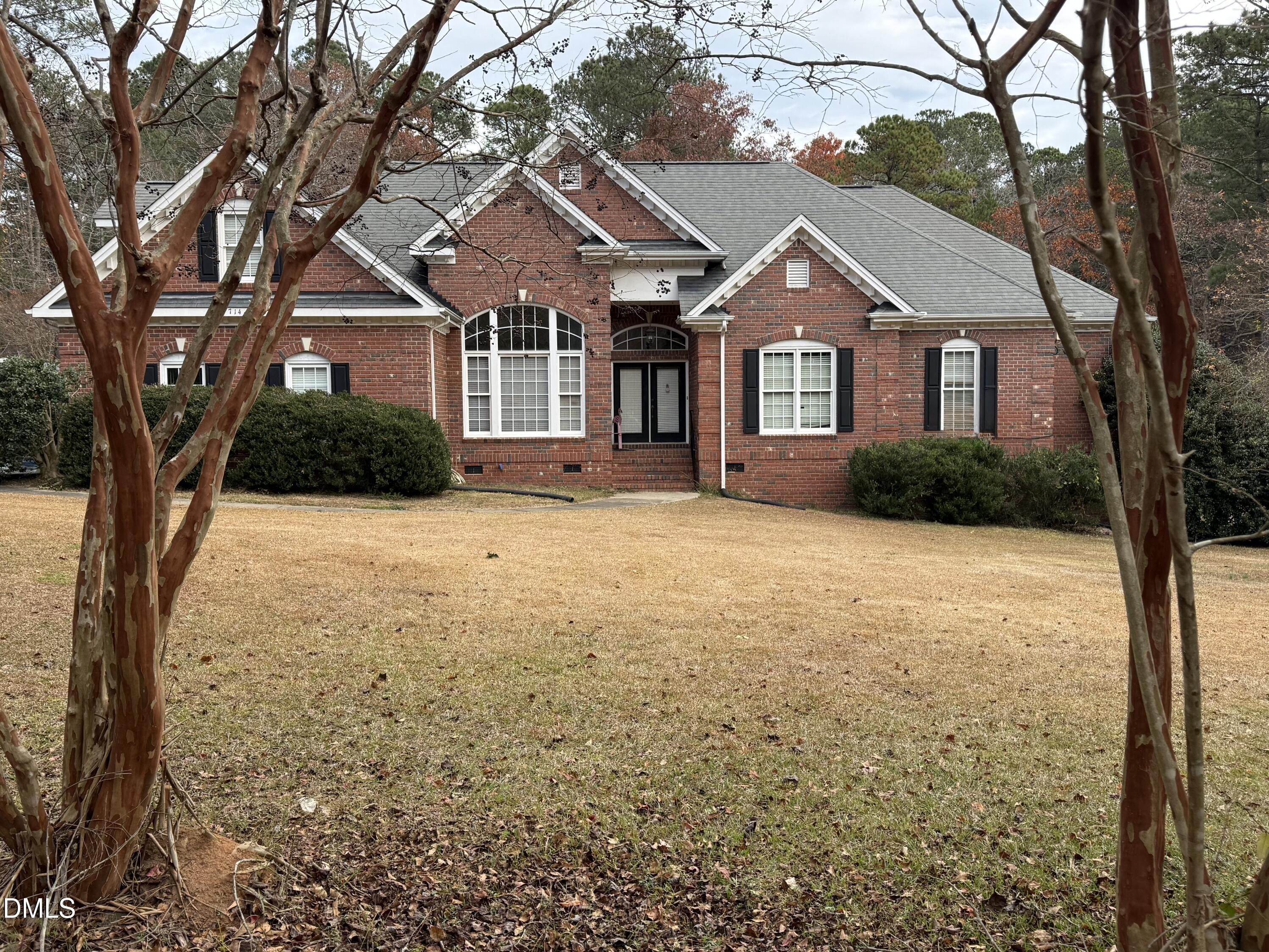 714 Moncure School Road Moncure, NC 27559 - Photo 2 of 7 a front view of a house with yard and trees