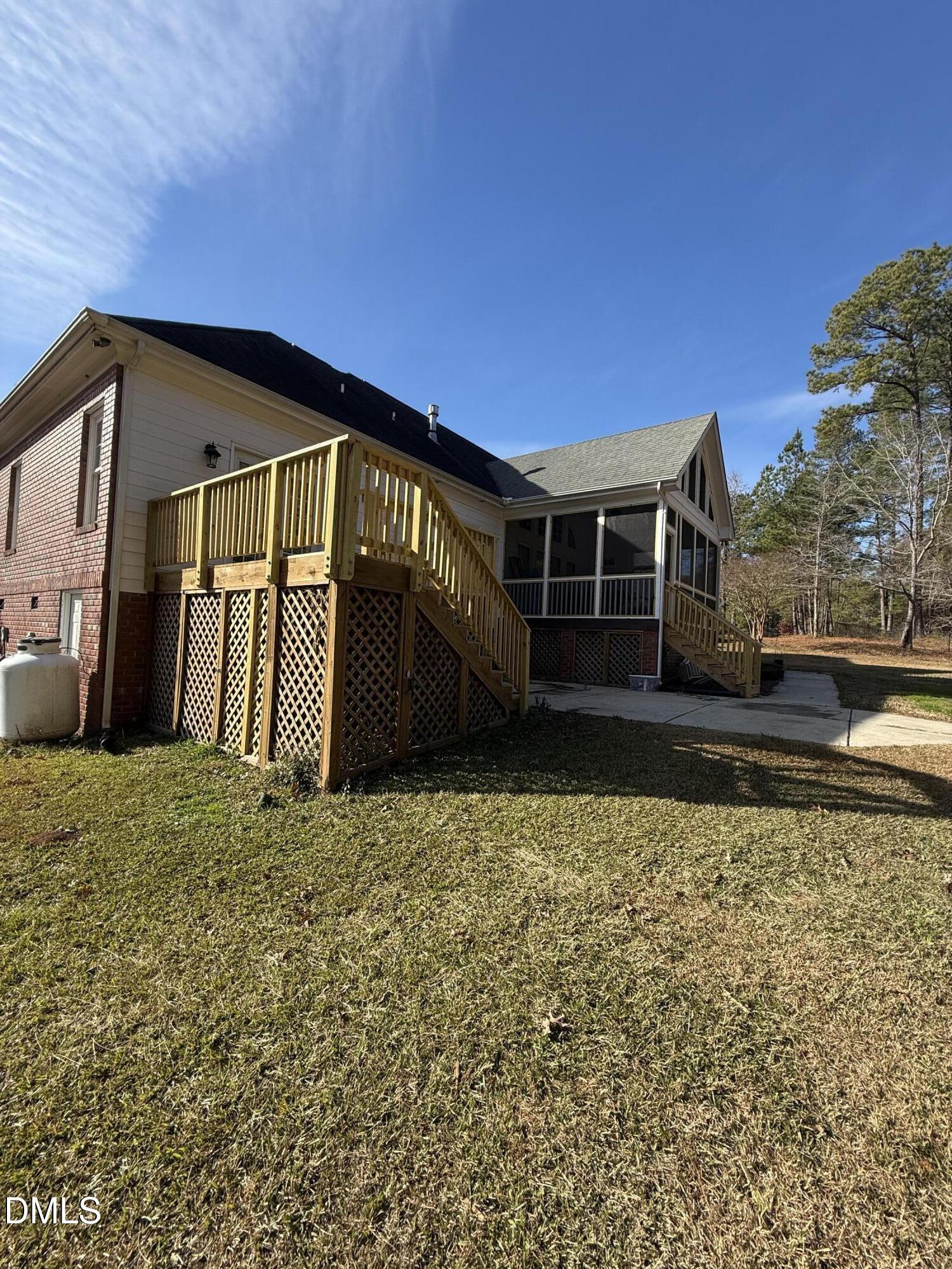 714 Moncure School Road Moncure, NC 27559 - Photo 3 of 7 a backyard of a house with lots of green space