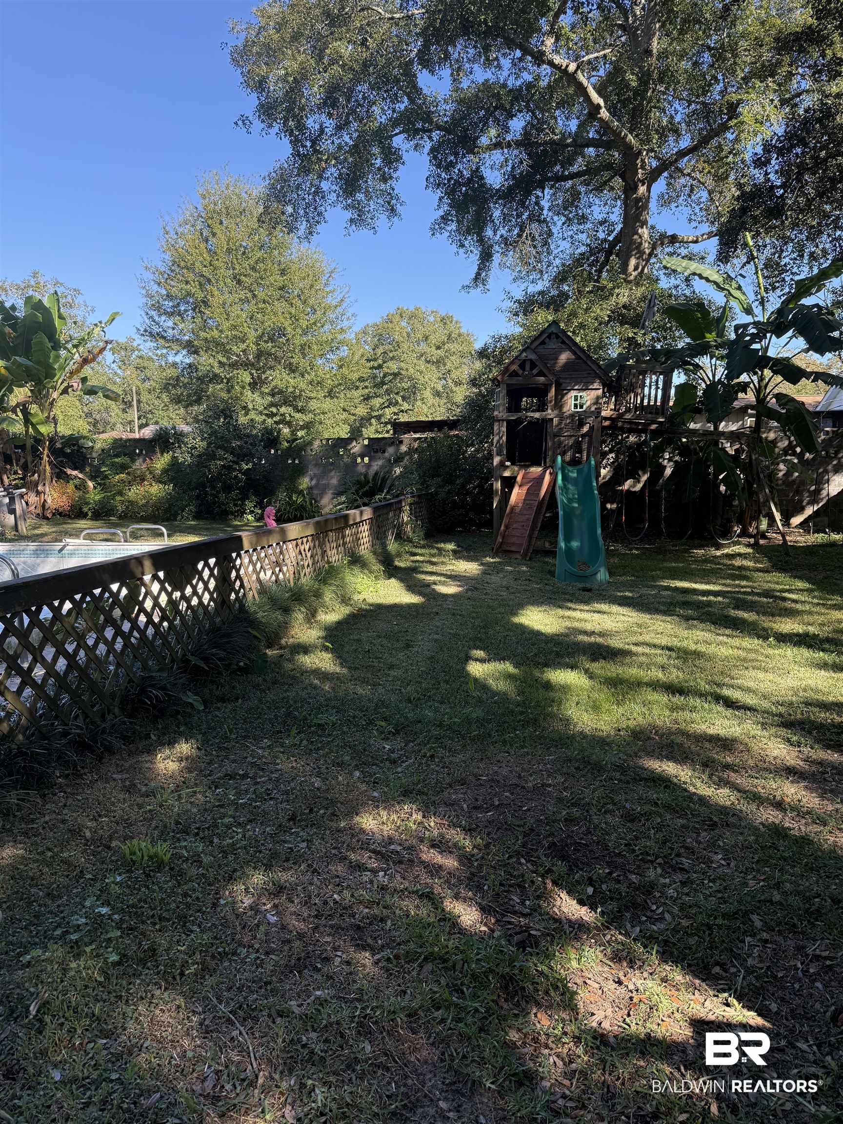 22173 1st Street Silverhill, AL 36576 - Photo 15 of 16 View of yard with a playground