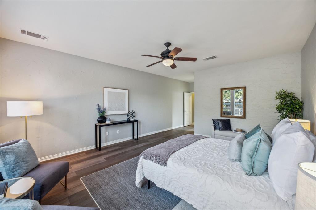 1302 Briar Ridge Drive Keller, TX 76248 - Photo 15 of 39 a bedroom with a bed and a chandelier