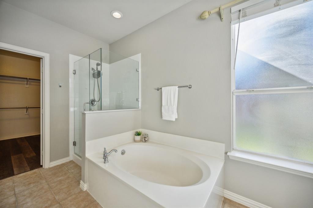 1302 Briar Ridge Drive Keller, TX 76248 - Photo 17 of 39 a white bath tub sitting next to a white sink