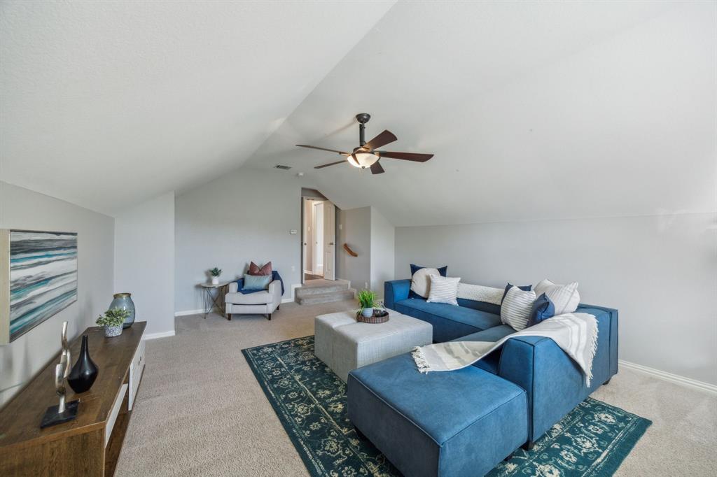 1302 Briar Ridge Drive Keller, TX 76248 - Photo 23 of 39 a living room with furniture and a chandelier