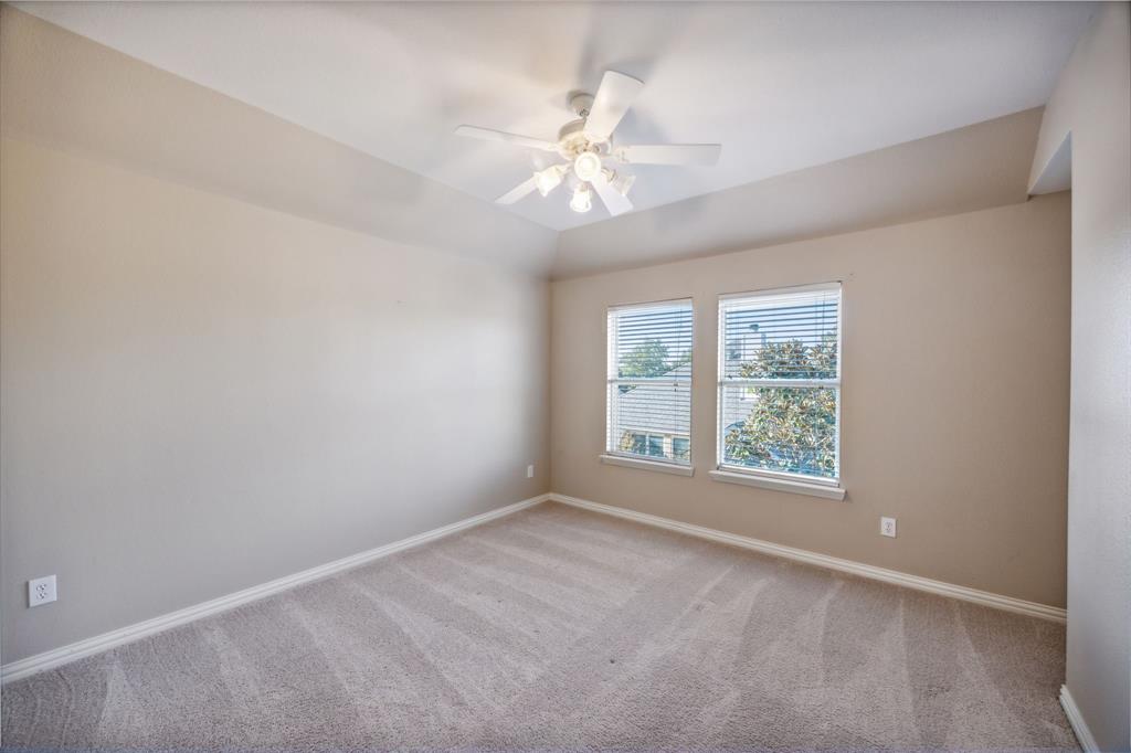 1302 Briar Ridge Drive Keller, TX 76248 - Photo 24 of 39 an empty room with a window and a fan