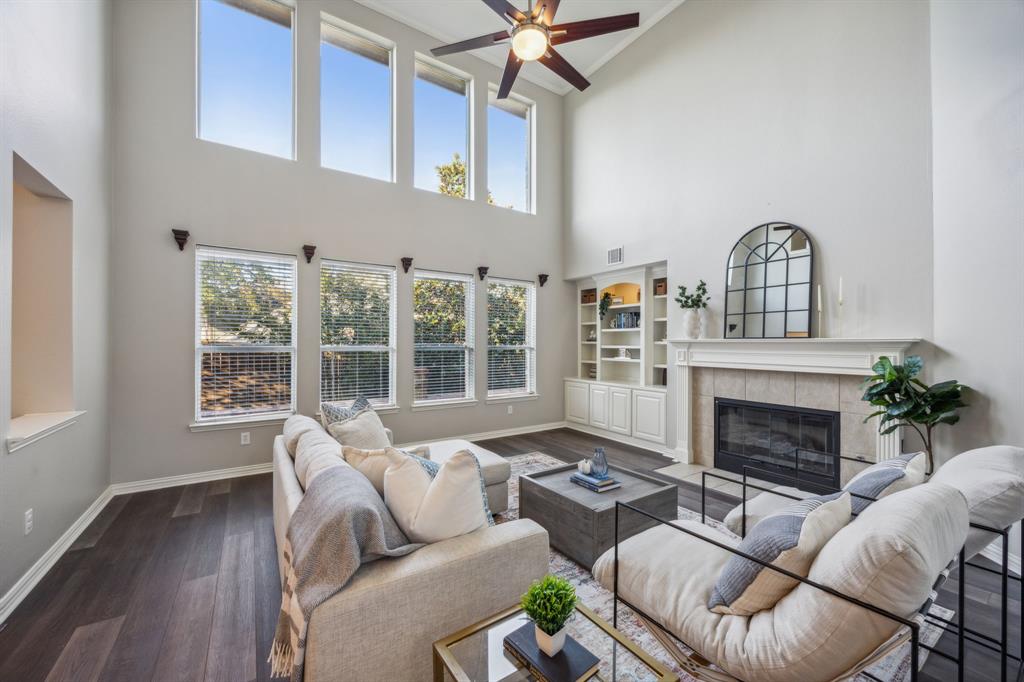 1302 Briar Ridge Drive Keller, TX 76248 - Photo 4 of 39 a living room with furniture a fireplace and a large window