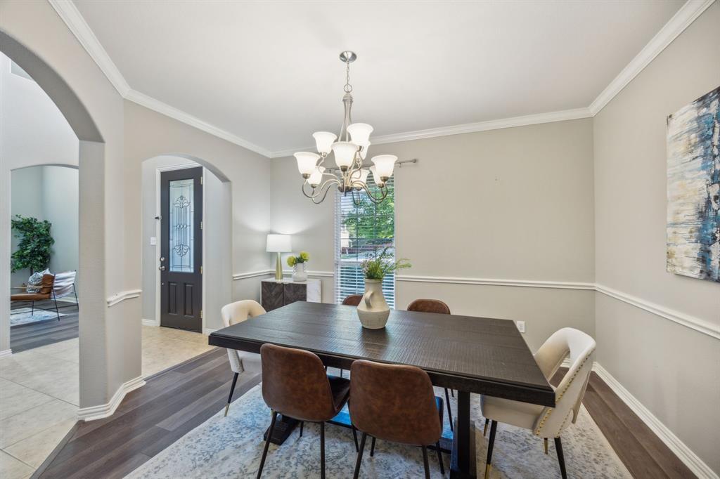 1302 Briar Ridge Drive Keller, TX 76248 - Photo 10 of 39 a view of a dining room with furniture and wooden floor