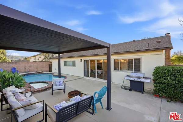 a outdoor living space with furniture and garden view