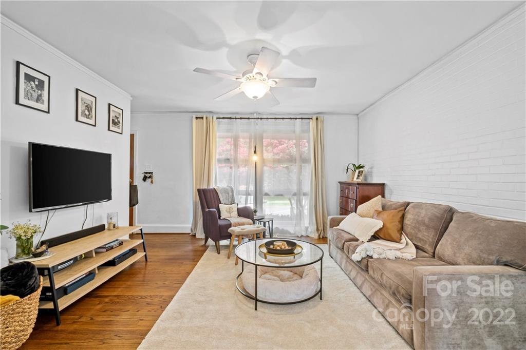 4220 Randolph Road Charlotte, NC 28211 - Photo 7 of 27 a living room with furniture and a flat screen tv