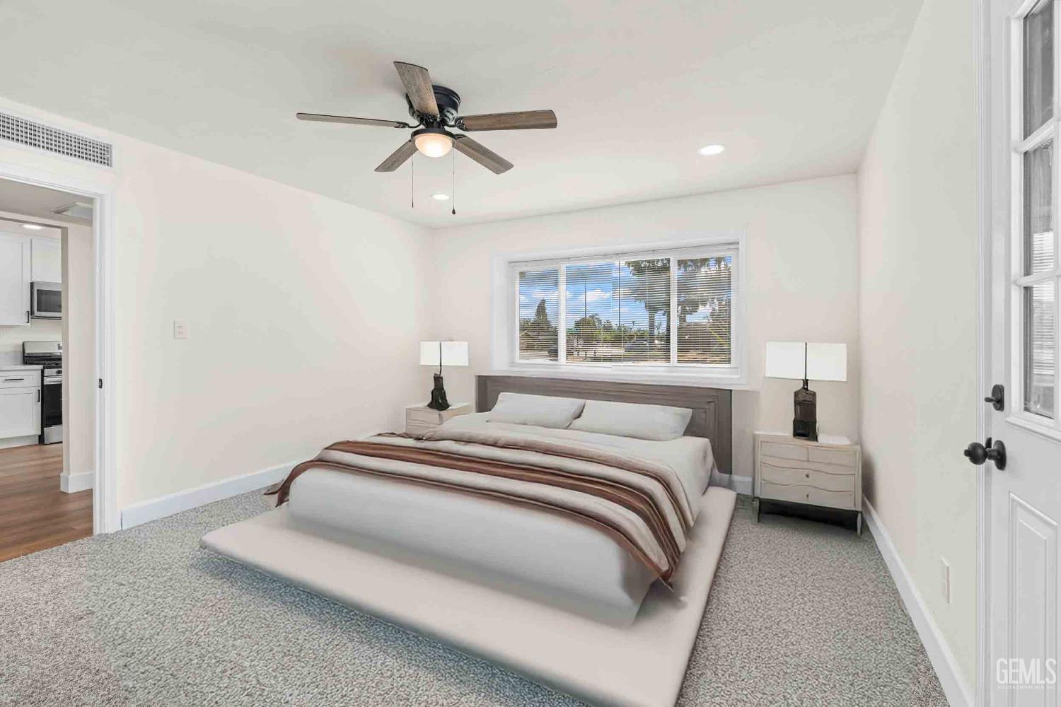 Undisclosed Address Bakersfield, CA 93307 - Photo 17 of 46 a bedroom with a bed and window