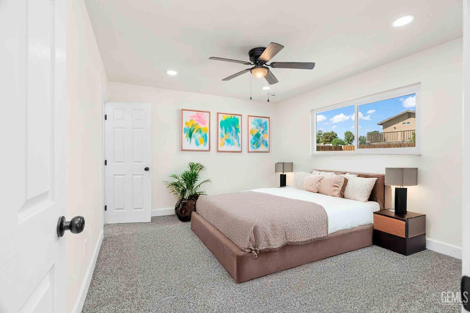 Undisclosed Address Bakersfield, CA 93307 - Photo 28 of 46 a bedroom with a bed and painting on the wall