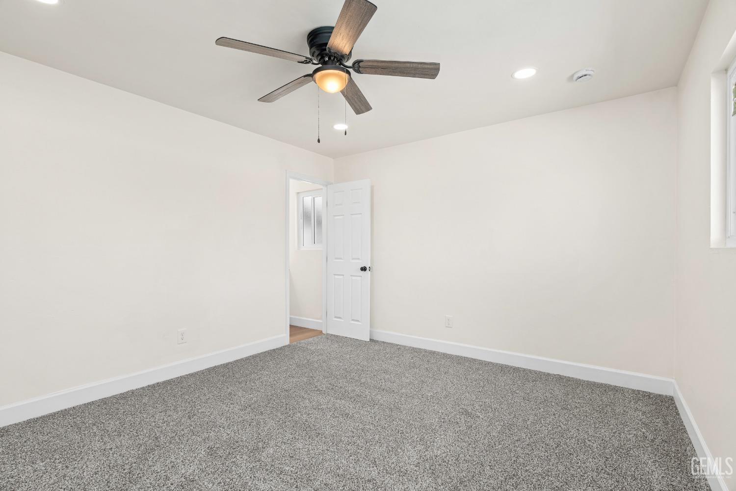 Undisclosed Address Bakersfield, CA 93307 - Photo 30 of 46 an empty room with a ceiling fan and a fan