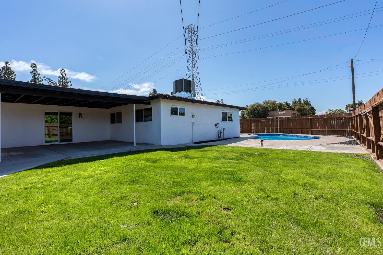Undisclosed Address Bakersfield, CA 93307 - Photo 37 of 46 a front view of a house with garden