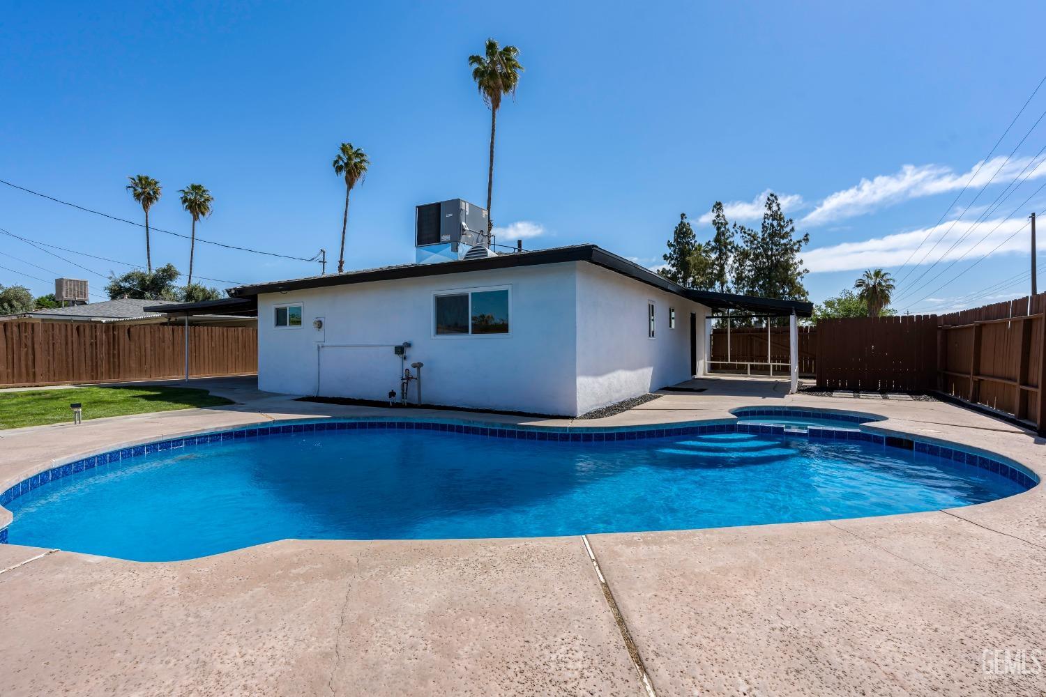 Undisclosed Address Bakersfield, CA 93307 - Photo 38 of 46 a view of a house with pool and sitting area