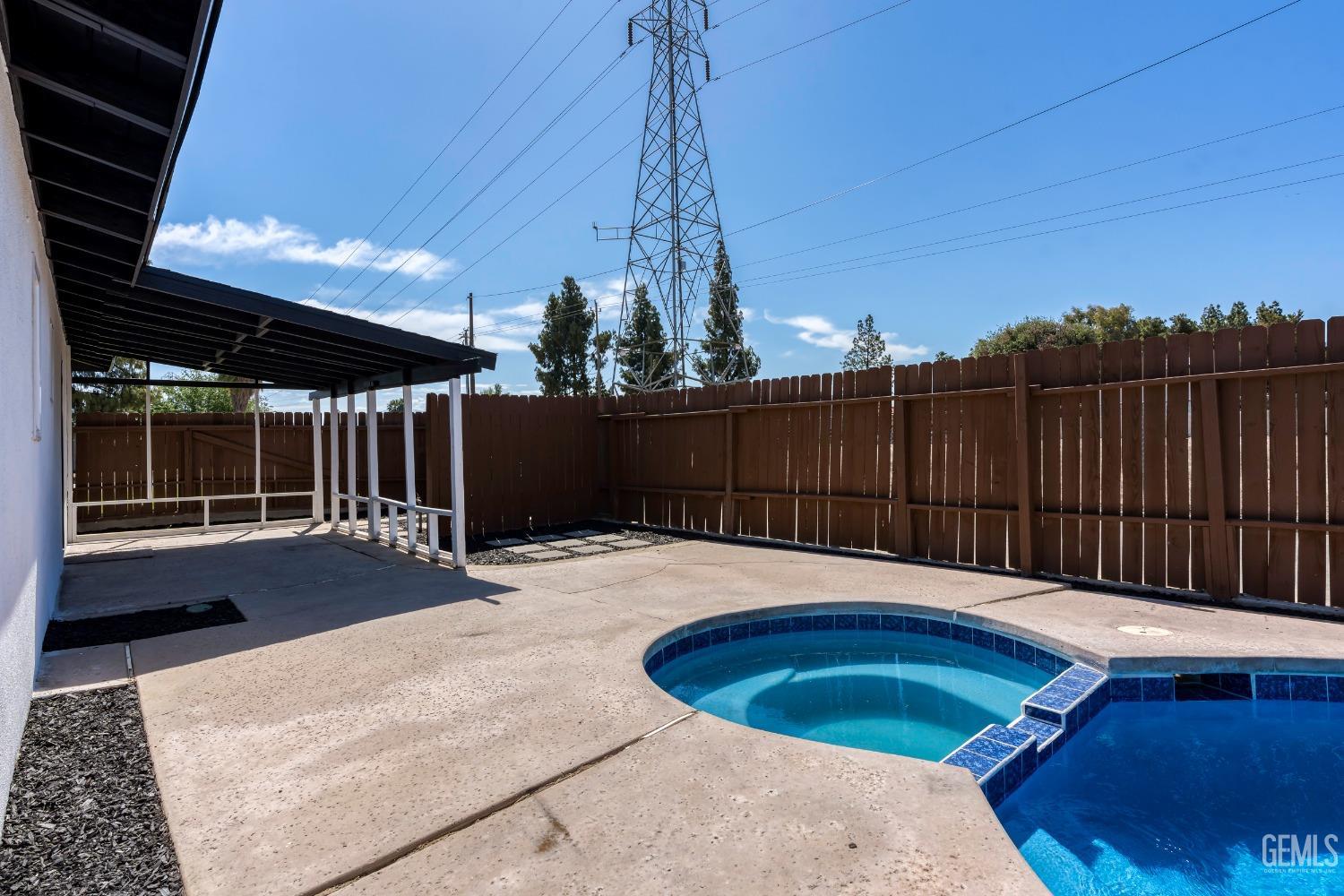 Undisclosed Address Bakersfield, CA 93307 - Photo 41 of 46 a view of a backyard with a small cabin
