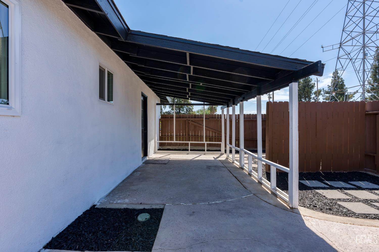 Undisclosed Address Bakersfield, CA 93307 - Photo 43 of 46 a view of backyard with hardwood and deck