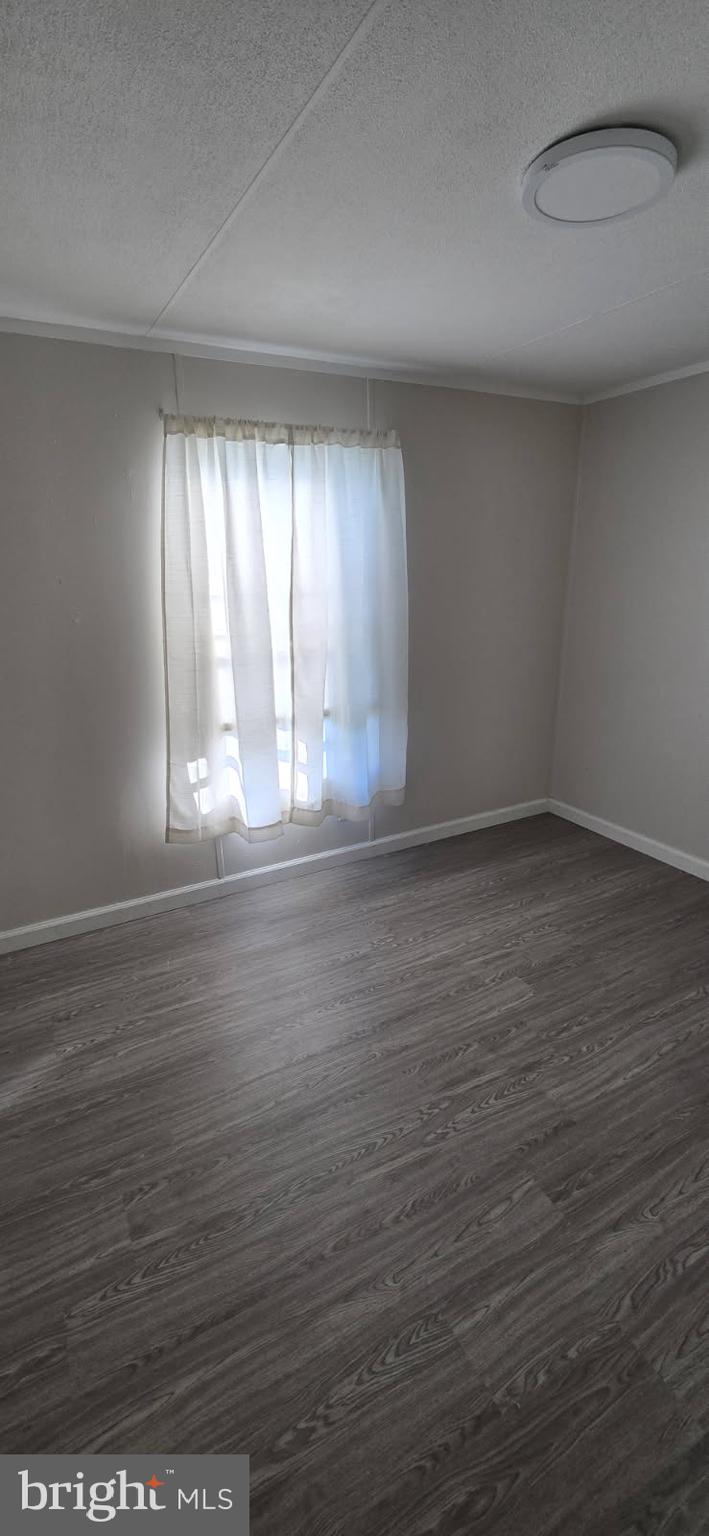 1923 Bennett Road Aberdeen, MD 21001 - Photo 11 of 20 wooden floor in an empty room with a window
