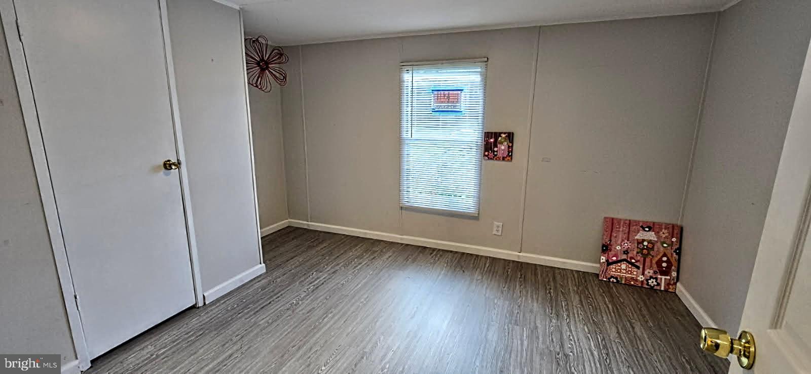 1923 Bennett Road Aberdeen, MD 21001 - Photo 13 of 20 an empty room with wooden floor and windows