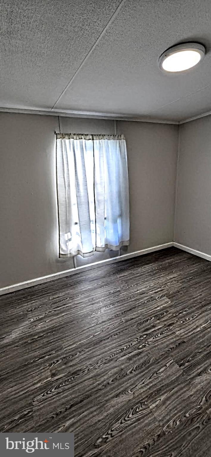 1923 Bennett Road Aberdeen, MD 21001 - Photo 10 of 20 a view of empty room with wooden floor and fan