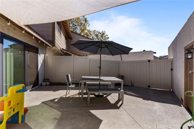 a patio with table and chairs