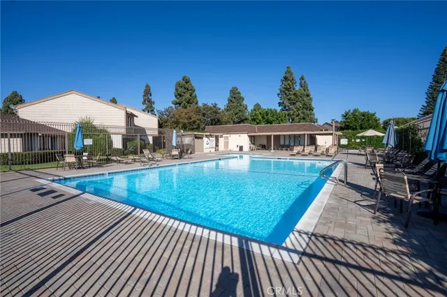 a view of a swimming pool with sitting area