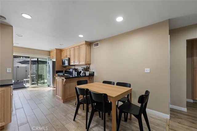 a kitchen with a table and chairs in it