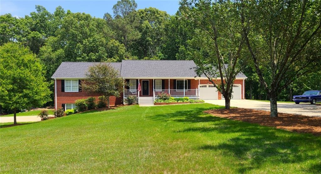 167 Evergreen Path Dallas, GA 30132 - Photo 1 of 1 a front view of a house with yard patio and green space