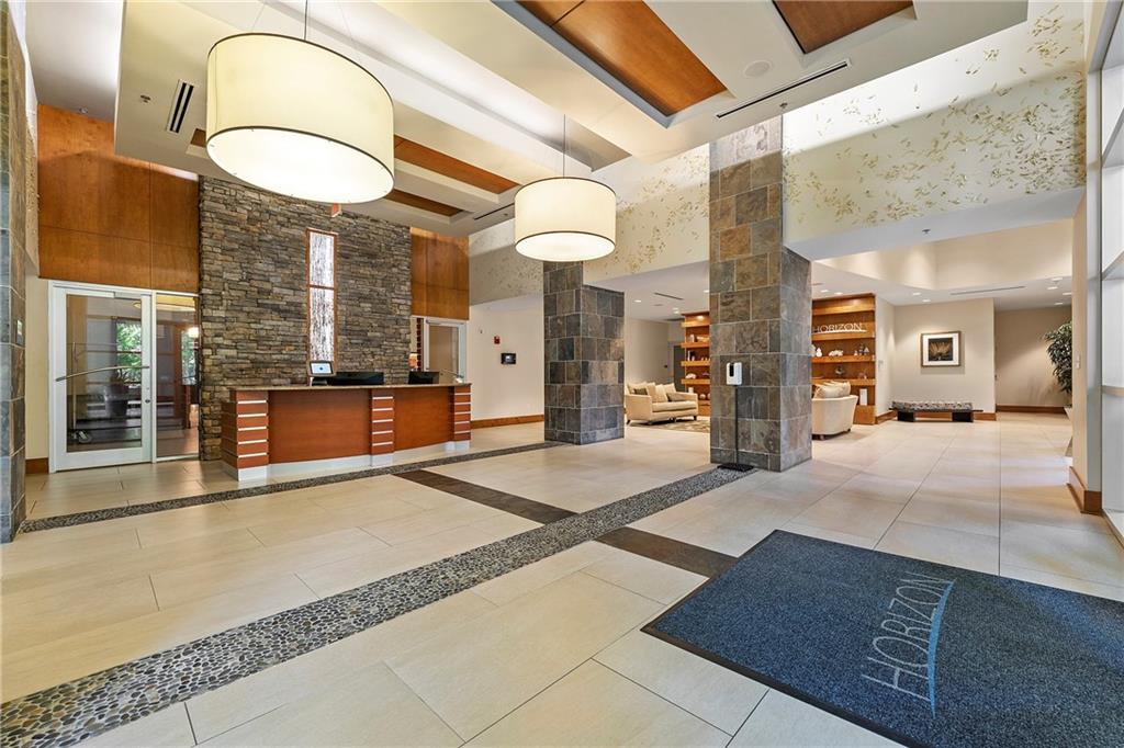 3300 Windy Ridge Parkway Southeast, Unit 1112 Atlanta, GA 30339 - Photo 36 of 43 a view of lobby with a ceiling fan and a rug