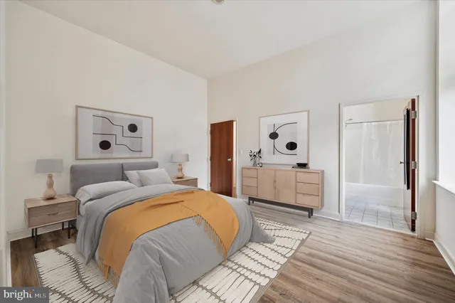 a bedroom with a bed and a dresser